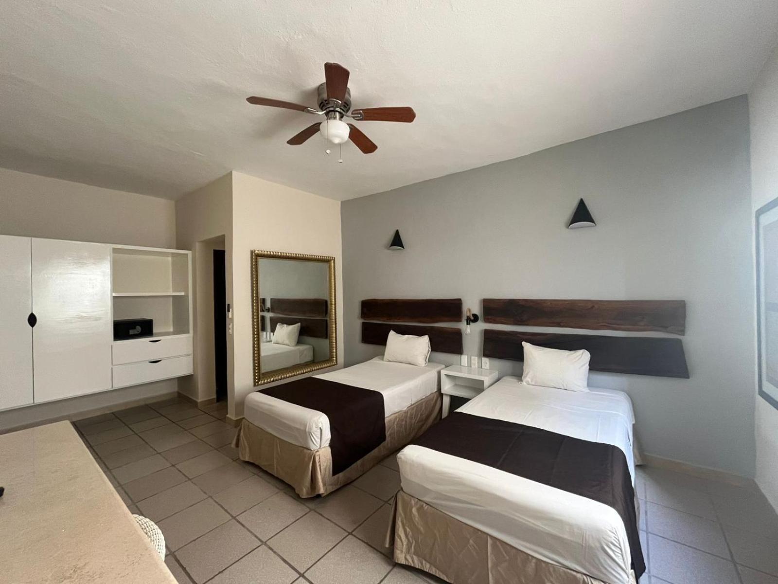 Family Room with One Queen Bed and Two Twin Beds - Non-Smoking